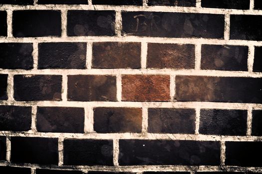 Aged and weathered old brick wall texture in a vintage retro design 