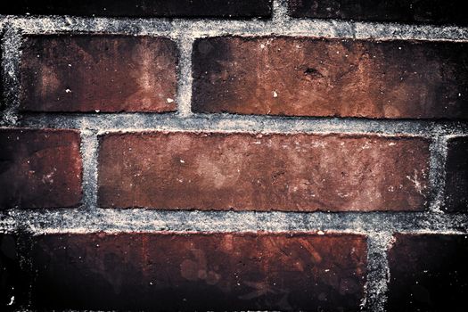 Aged and weathered old brick wall texture in a vintage retro design 