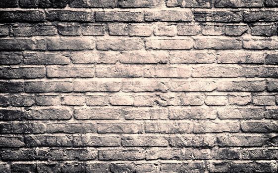 Aged and weathered old brick wall texture in a vintage retro design 