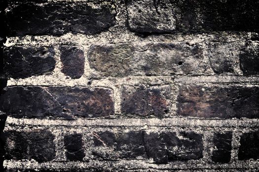 Aged and weathered old brick wall texture in a vintage retro design 