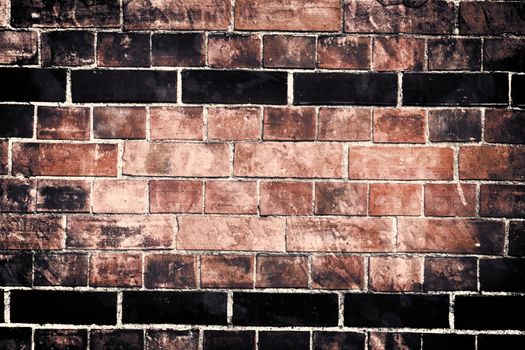 Aged and weathered old brick wall texture in a vintage retro design 