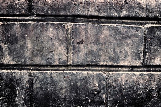 Aged and weathered old brick wall texture in a vintage retro design 