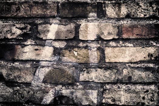 Aged and weathered old brick wall texture in a vintage retro design 