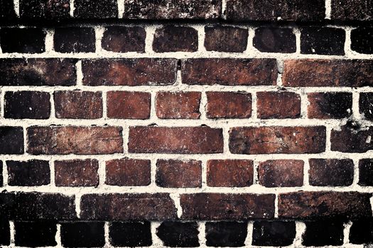 Aged and weathered old brick wall texture in a vintage retro design 