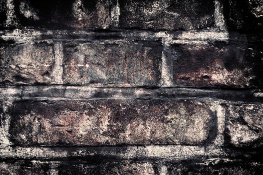 Aged and weathered old brick wall texture in a vintage retro design 