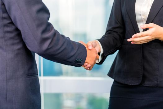 Close up of business people shaking hands