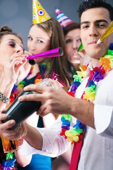 Party People in bar celebrating carnival, group having fun with drinks and a barkeeper