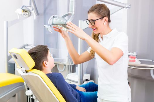 Dentist giving patient advice in dental surgery