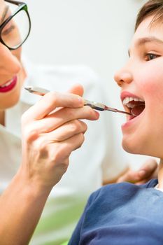 Dentist giving patient advice in dental surgery