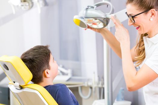 Dentist giving patient advice in dental surgery