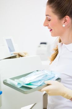 Assistant with sterile dentist tools