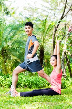Asian Chinese couple at outdoor fitness training