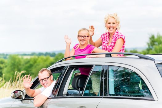 Family driving in car