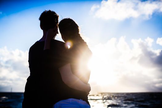 Couple enjoying romantic sunset at German north sea beach