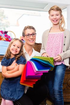 Family buying supplies in handicraft store