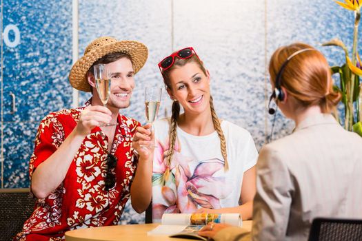 Man and woman recommending travel agency being satisfied with the service