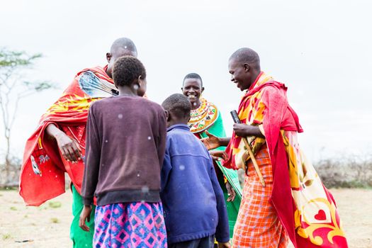 Massai tribe family celebrating and dancing