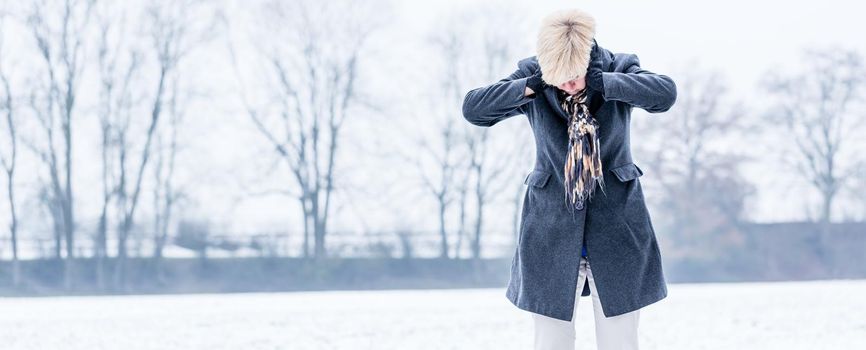 Senior woman with burnout in winter