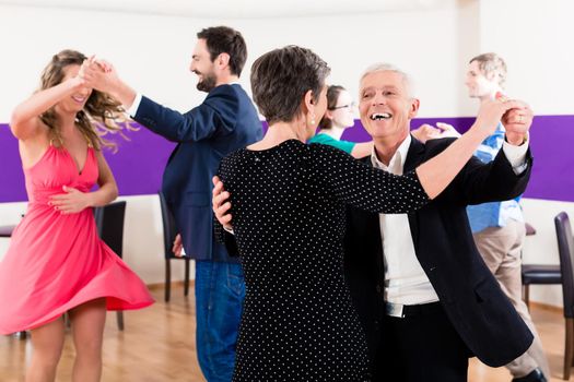 Group of people dancing in dance class having fun