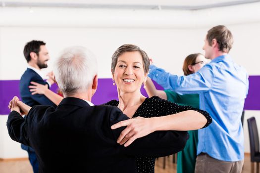 Group of people dancing in dance class having fun