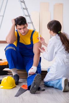 Injured worker being assisted by doctor