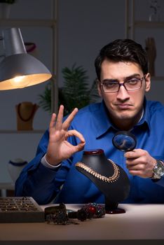 Jeweler working in his workshop late at night