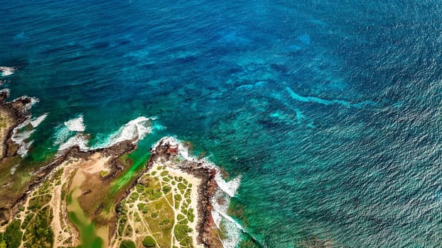 Aerial view of ocean waves and fantastic rocky shoreline, Aerial view of a coastline along Great Ocean Road, Aerial view of waves hitting rocks on beach with turquoise water