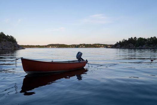 Small wooden boat in the middle of a lake, Lonely wooden boat in the water, isolated wooden boat, Top view of a white small wooden boat floating in the middle of a lake