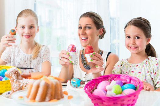 Basket with Easter eggs having been colored by family