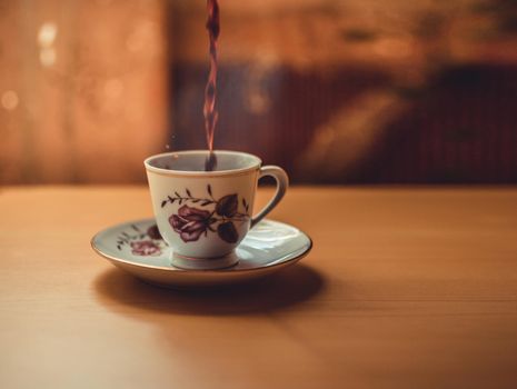 Photo of a cup of freshly brewed coffee, cup of coffee on wooden background, cup of coffee with copy space