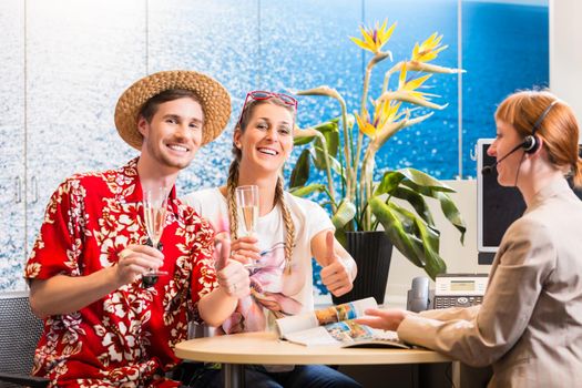 Man and woman recommending travel agency being satisfied with the service