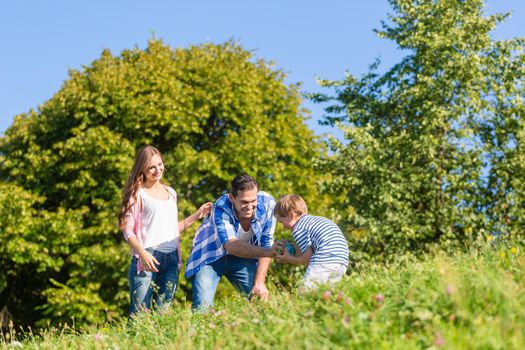 Family in grass on meadow