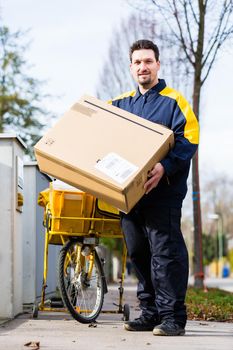 Postman delivering packet wrapped as present