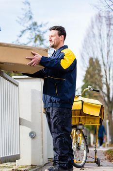 Postman delivering packet wrapped as present