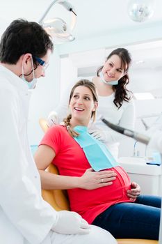 Pregnant woman at dentist before treatment