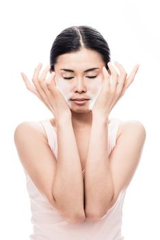 Beautiful young Asian woman applying facial moisturizer cream for sensitive skin care