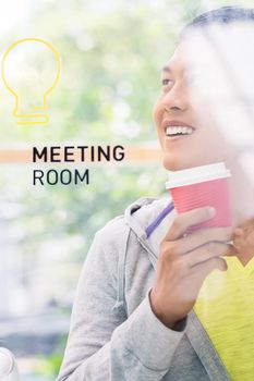 Portrait of creative young Asian employee smiling while thinking of innovative business ideas in the meeting room