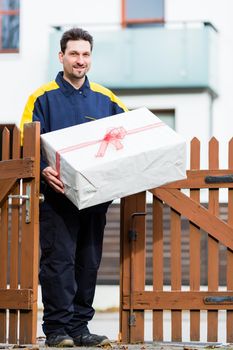 Postman delivering packet wrapped as present