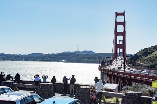 Golden Gate Bridge ans some tourists, San Francisco California, USA, March 31, 2020