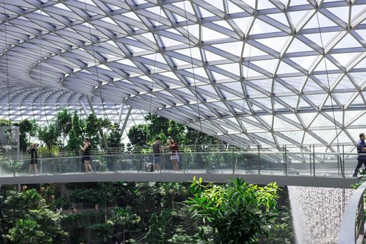 Singapore, Changi/Singapore- Decmber 28 2019: Singapore Jewel Changi Airport Mall- Canopy Bridge with tourists