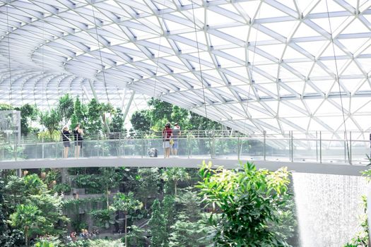 Singapore, Changi/Singapore- Decmber 28 2019: Singapore Jewel Changi Airport Mall- Canopy Bridge with tourists