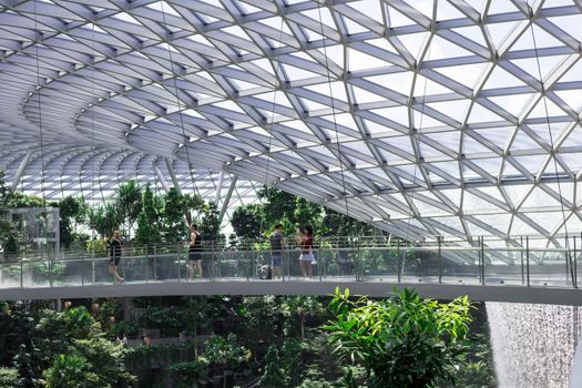 Singapore, Changi/Singapore- Decmber 28 2019: Singapore Jewel Changi Airport Mall- Canopy Bridge with tourists
