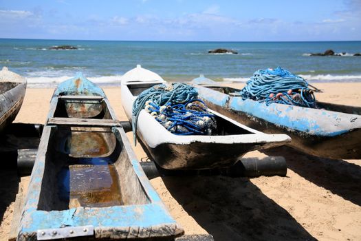 salvador, bahia, brazil - february 4, 2021: rowing boats used by fishermen on Itapua beach in the city of Salvador.
