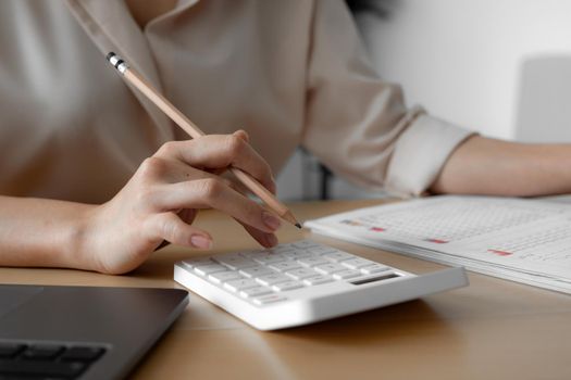 Close up of Businessperson's Hand Calculating Bill, budget, monthly report With Calculator, Business Accounting Saving Concept.