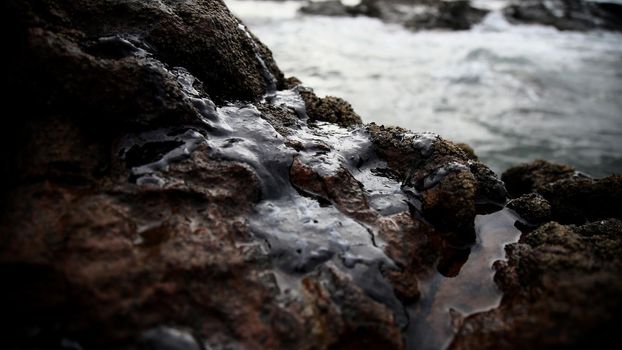 salvador, bahia / brazil - november 3, 2019: Oil macha is seen on the Rio Vermelho beach in Salvador. The site was affected by oil spills on the Brazilian coast.