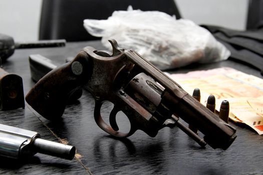 salvador, bahia / brazil - september 19, 2013: revolver caliber 38, apprehended by the police after police pursuit of a bandit in the city of Salvador.