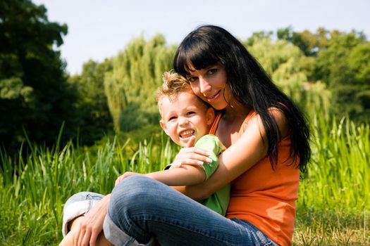 Mother and son outdoors at a wonderful summer day