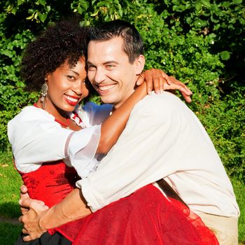 Couple in traditional Bavarian dress, Lederhosen and Dirndl