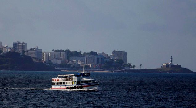 salvador, bahia / brazil - november 4, 2014: Speedboat crossing Salvador to Vera Cruz island, is seen sailing in Todos os Santos Bay.


 