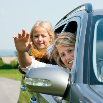 Family with kids in a car